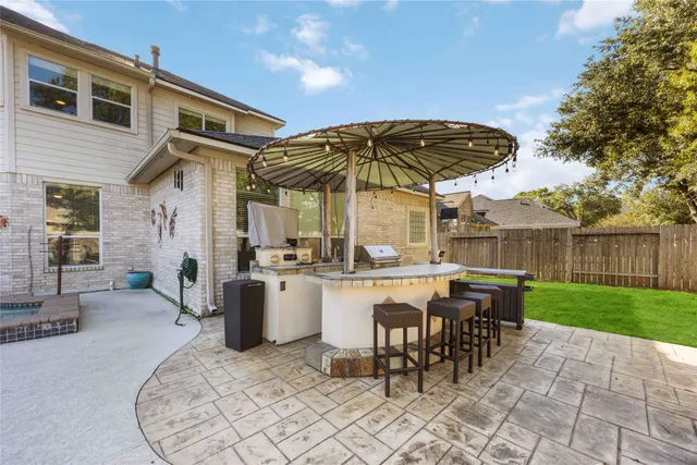 a view of backyard with outdoor seating