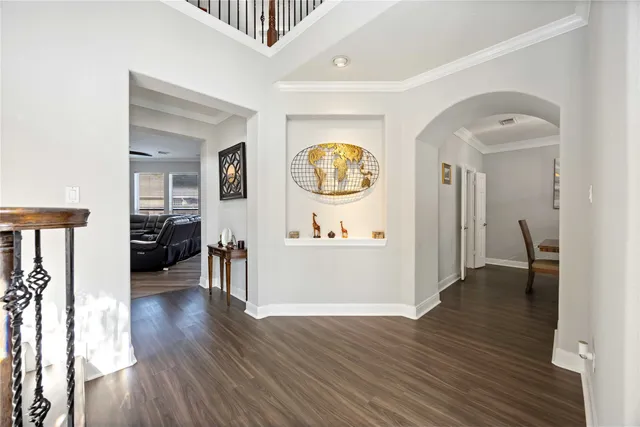 a view of a hallway view with wooden floor and staircase