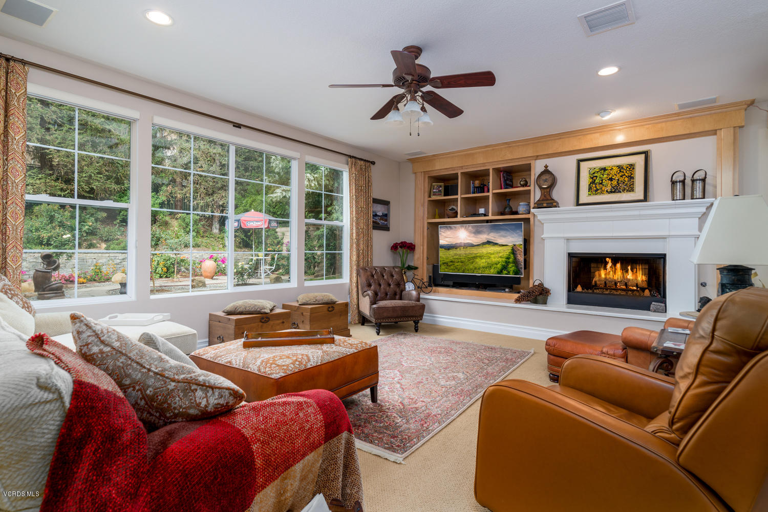 161 Laurel Ridge Drive Simi Valley, CA 93065 - Photo 16 of 50 a living room with furniture fireplace and a large window