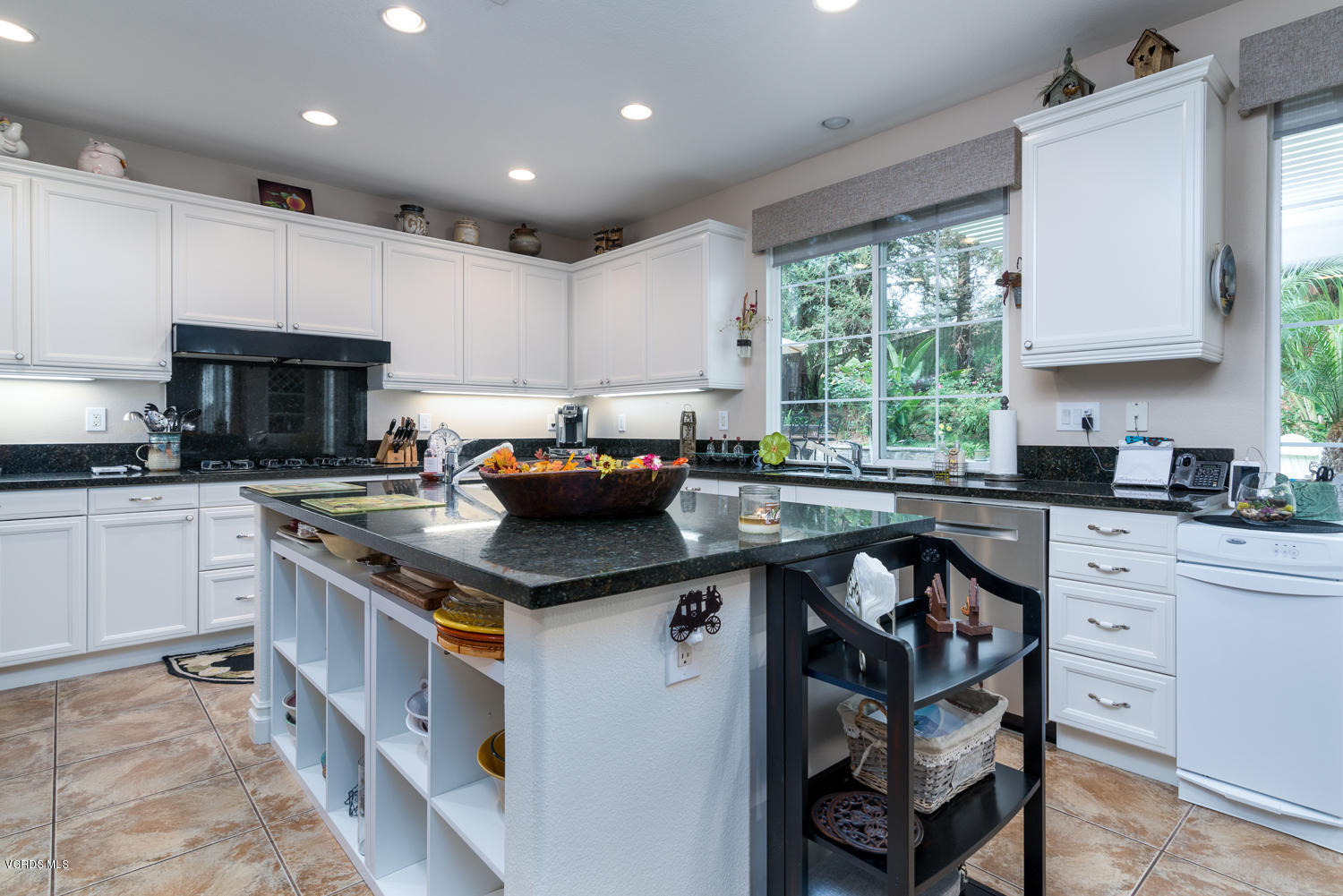161 Laurel Ridge Drive Simi Valley, CA 93065 - Photo 21 of 50 a kitchen with kitchen island granite countertop a sink appliances cabinets and a counter top space