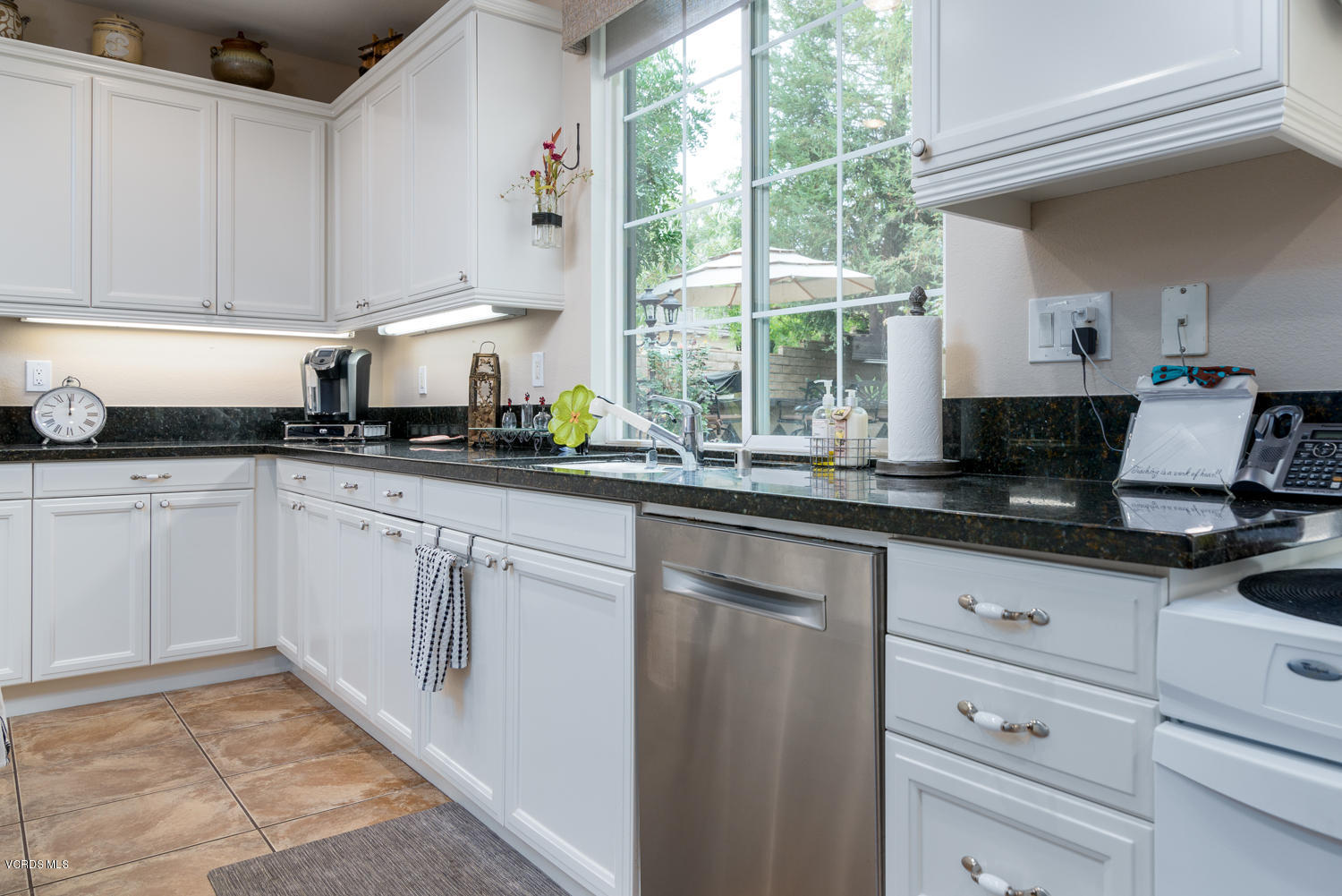 161 Laurel Ridge Drive Simi Valley, CA 93065 - Photo 23 of 50 a kitchen with granite countertop white cabinets white appliances a sink and a window