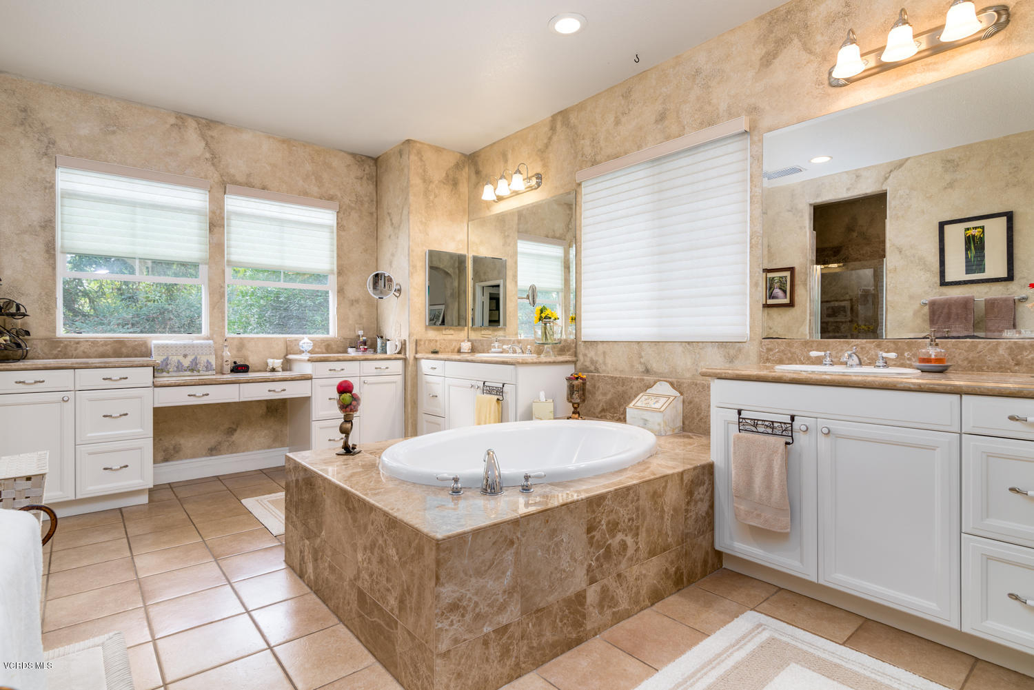 161 Laurel Ridge Drive Simi Valley, CA 93065 - Photo 31 of 50 a large white kitchen with a stove a sink dishwasher and a dining table with wooden floor