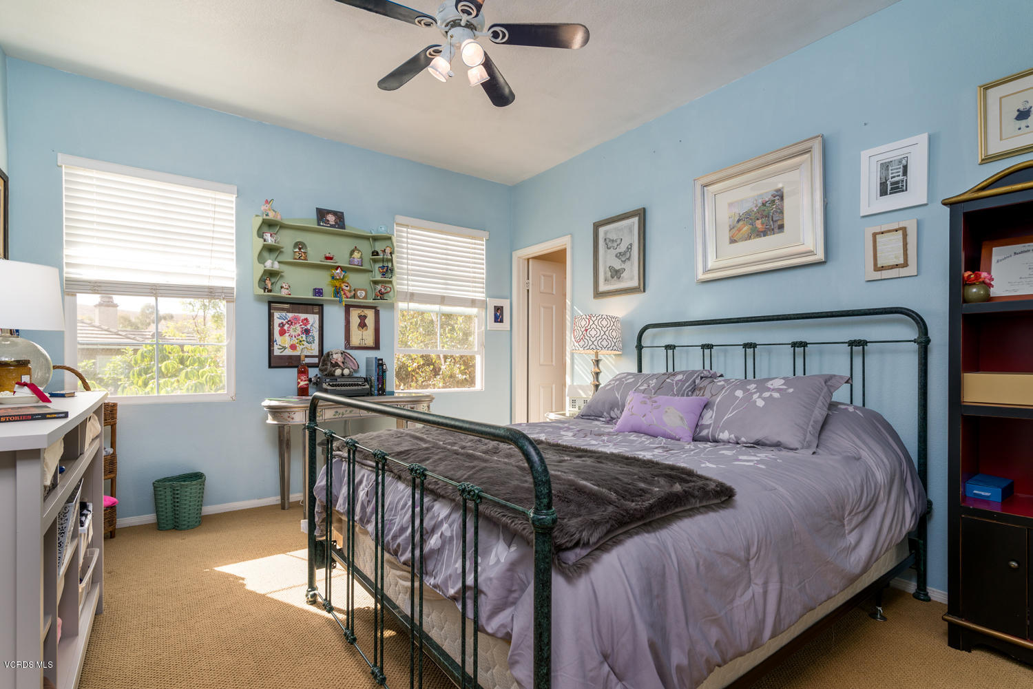 161 Laurel Ridge Drive Simi Valley, CA 93065 - Photo 39 of 50 a bed sitting in a bedroom next to a window with a chandelier