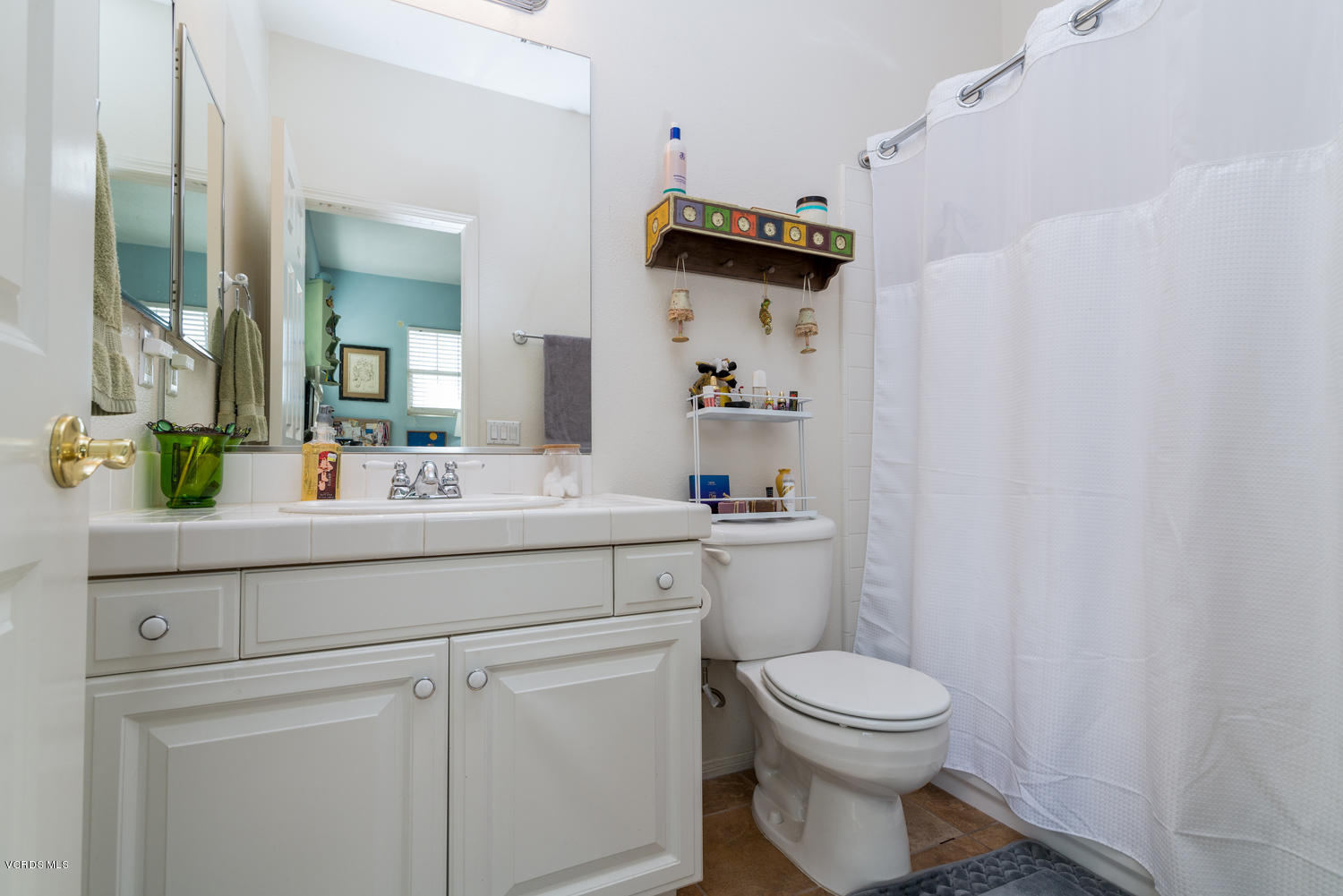 161 Laurel Ridge Drive Simi Valley, CA 93065 - Photo 40 of 50 a bathroom with a toilet a sink and a mirror