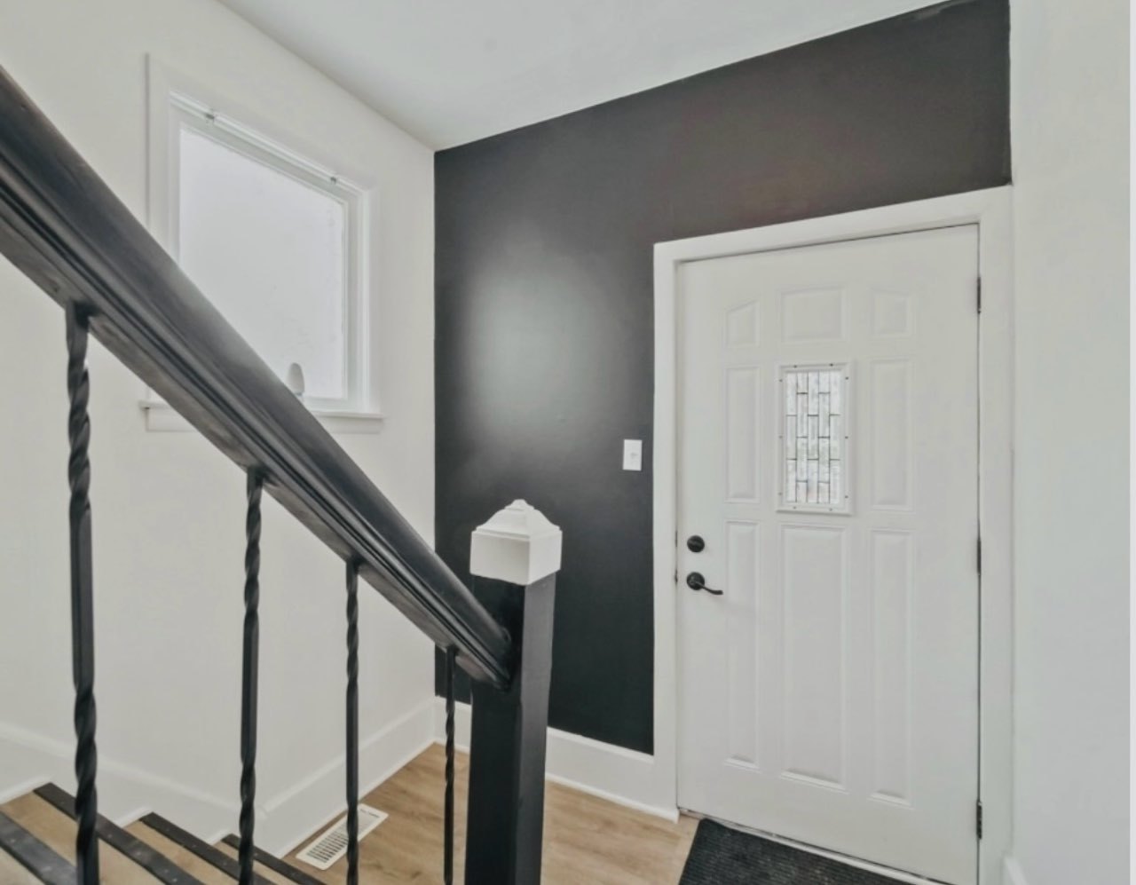 1216 Park Avenue, Unit 1 Chicago Heights, IL 60411 - Photo 2 of 10 a view of staircase with railing and white walls