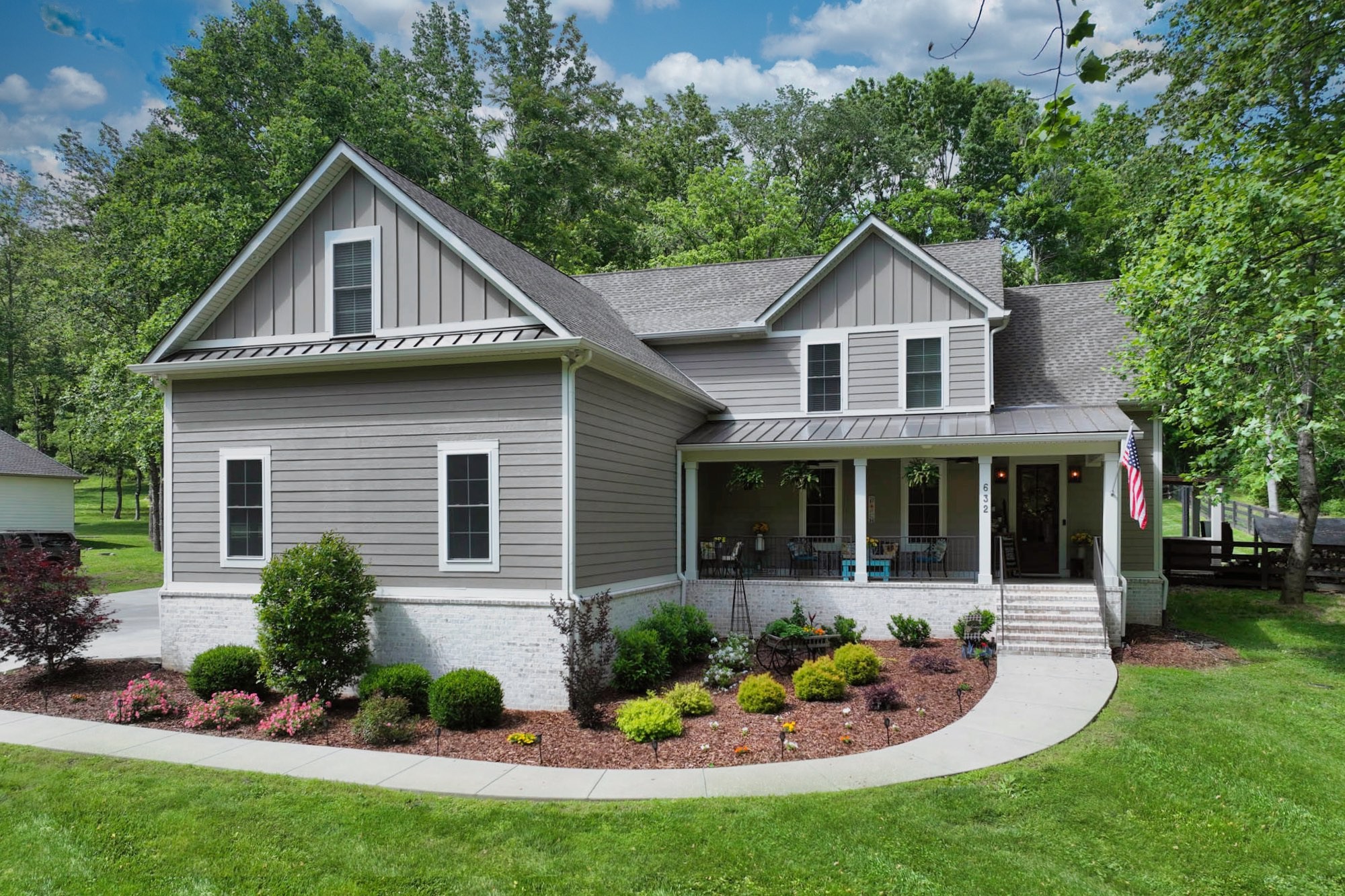 632 Weeping Willow Road Hendersonville, TN 37075 - Photo 1 of 42 a front view of a house with a yard and potted plants