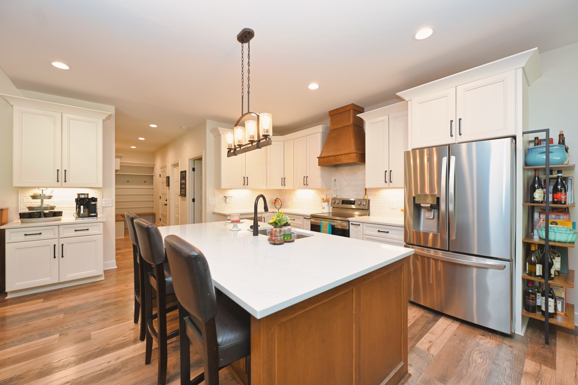 632 Weeping Willow Road Hendersonville, TN 37075 - Photo 12 of 42 a kitchen with a refrigerator a white stove top oven a sink dishwasher and a refrigerator with wooden floor