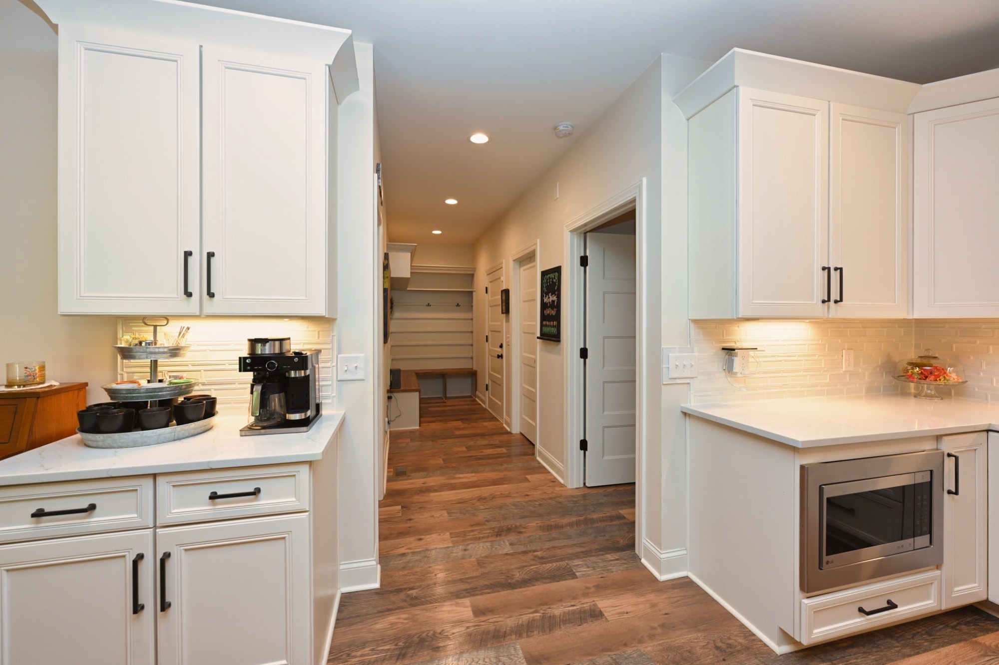 632 Weeping Willow Road Hendersonville, TN 37075 - Photo 13 of 42 a kitchen with stainless steel appliances white cabinets and a wooden floor