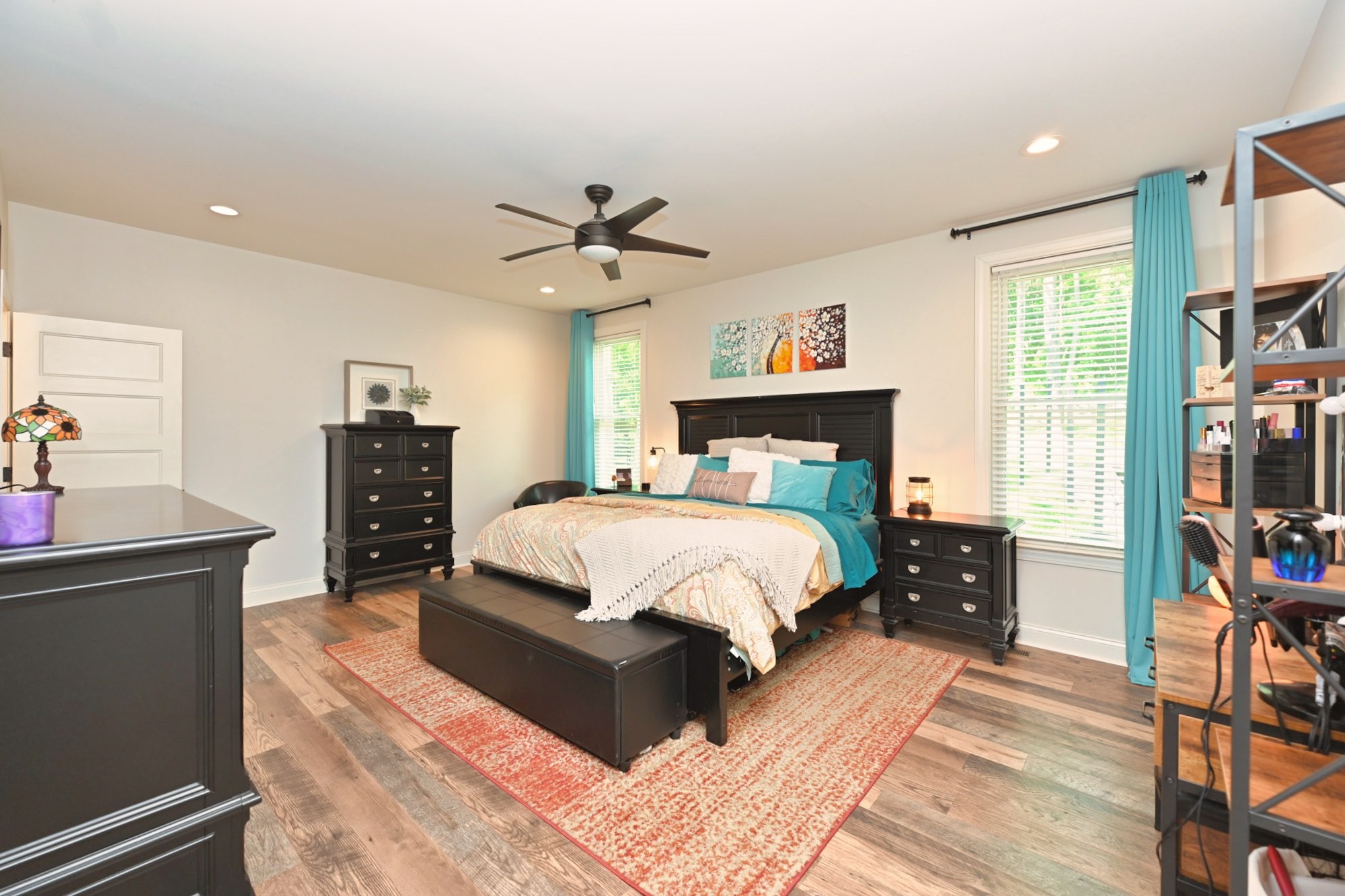 632 Weeping Willow Road Hendersonville, TN 37075 - Photo 16 of 42 a bedroom with a bed and a chandelier