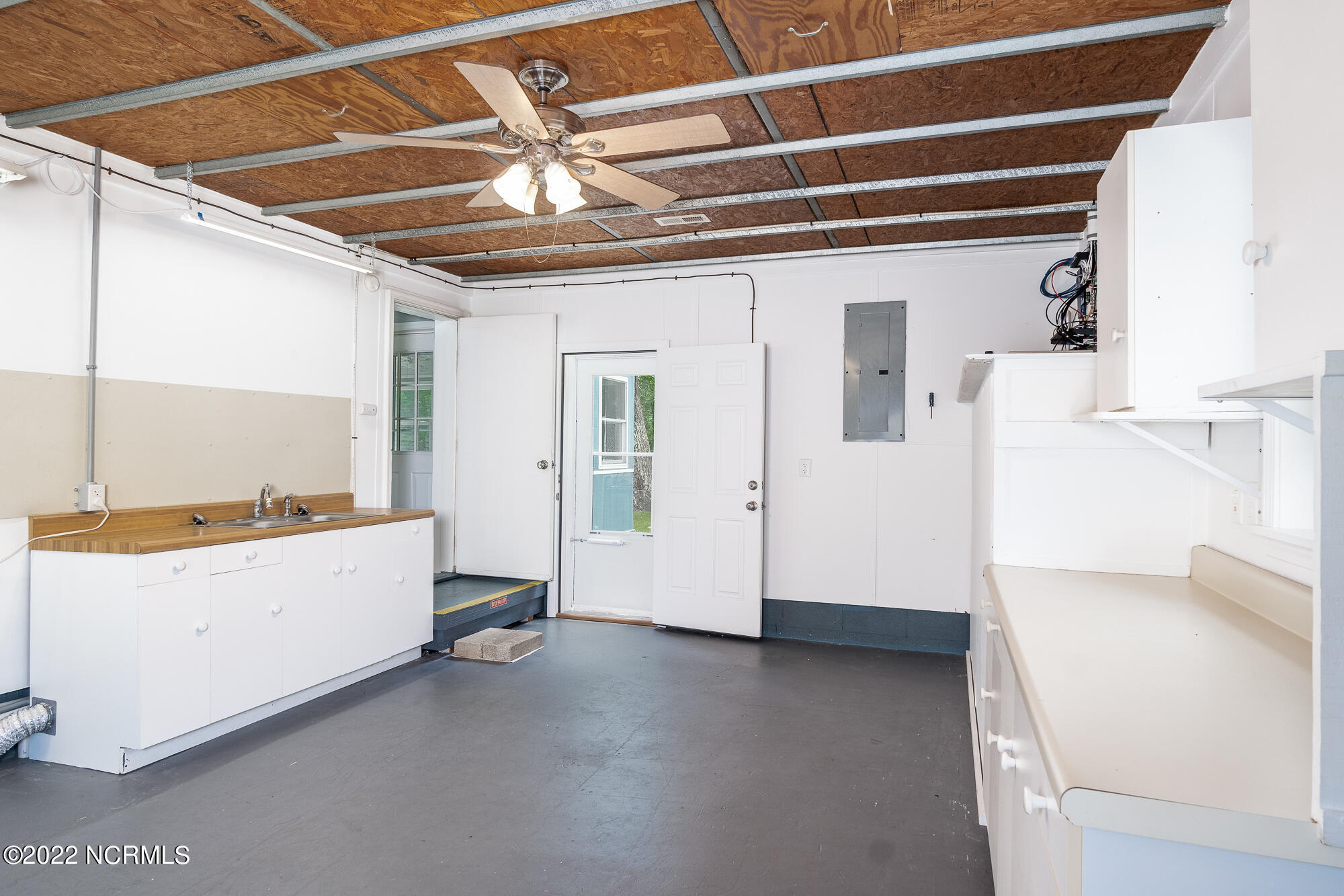 3105 Old Gate Road Morehead City, NC 28557 - Photo 22 of 35 Cabinets & sink with access to back yard