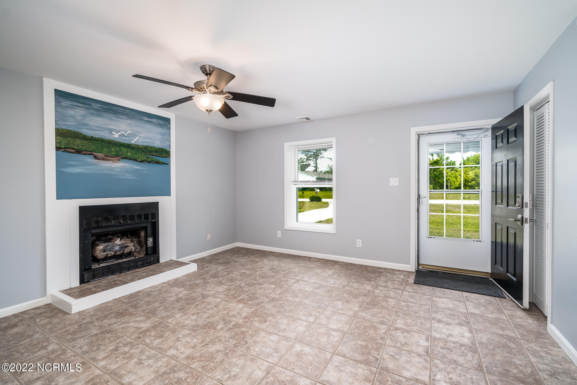3105 Old Gate Road Morehead City, NC 28557 - Photo 6 of 35 Handpainted mural above gas log FP