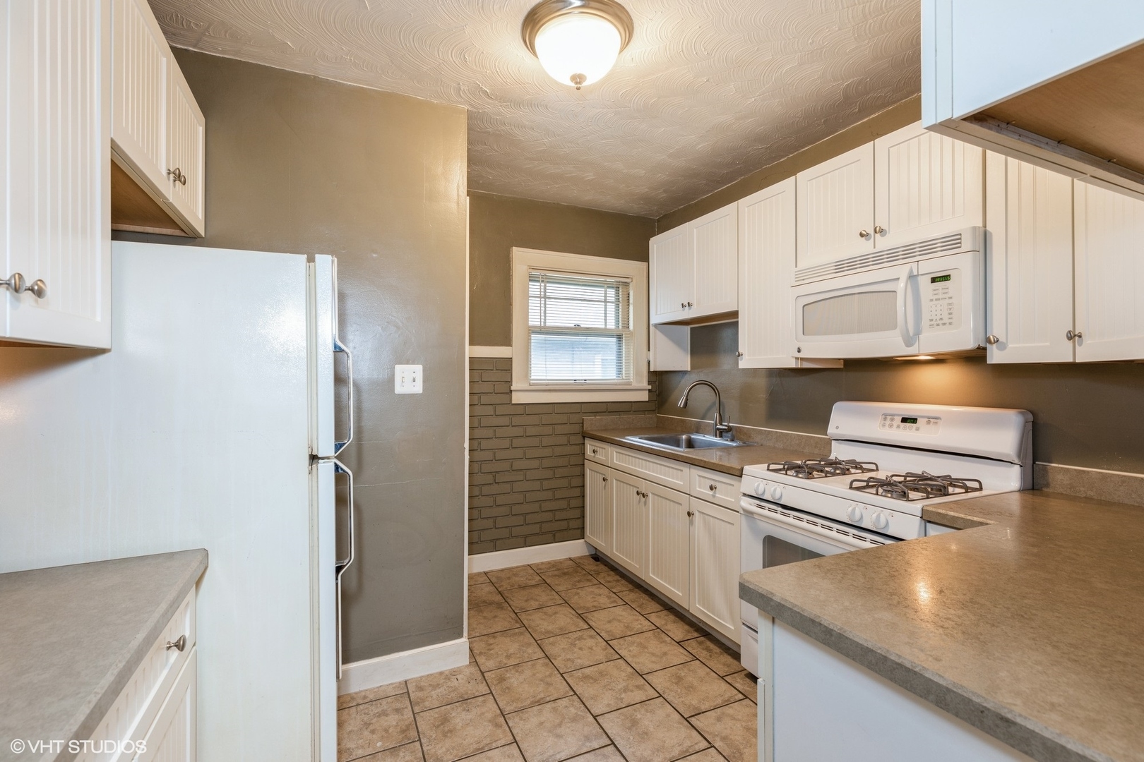 16703 Lincoln Street Hazel Crest, IL 60429 - Photo 6 of 16 a kitchen with stainless steel appliances granite countertop a stove a refrigerator and a sink