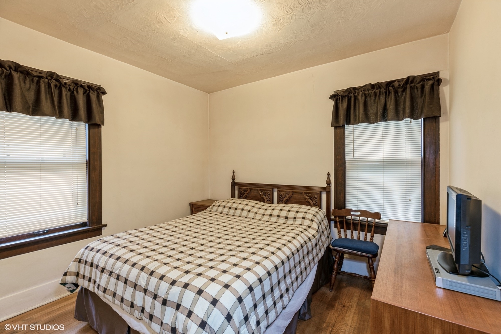16703 Lincoln Street Hazel Crest, IL 60429 - Photo 9 of 16 a bedroom with a bed and wooden floor