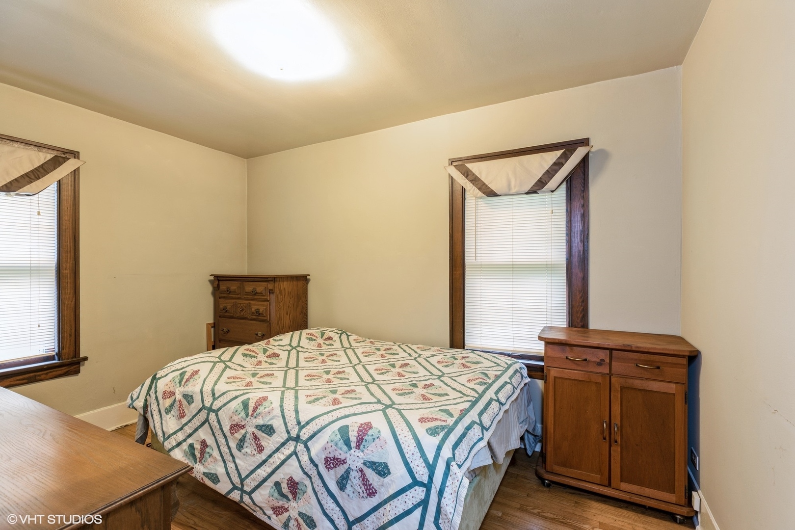 16703 Lincoln Street Hazel Crest, IL 60429 - Photo 10 of 16 a bedroom with a bed and a window