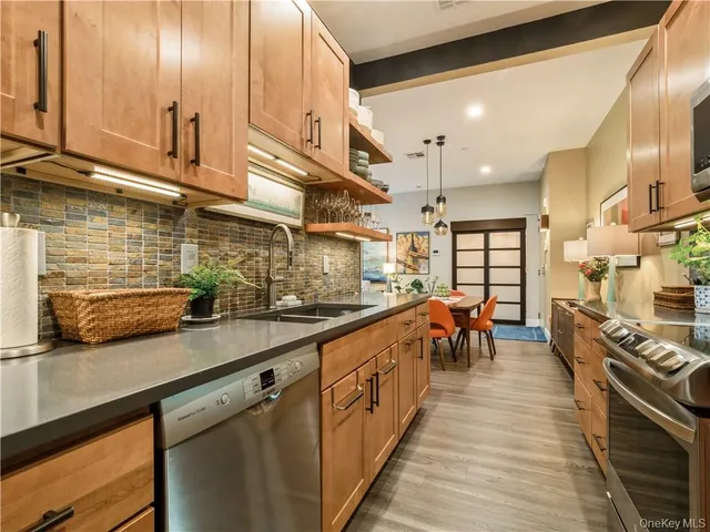 a kitchen with stainless steel appliances lots of counter top space