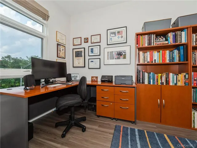 a room with furniture workspace and a window