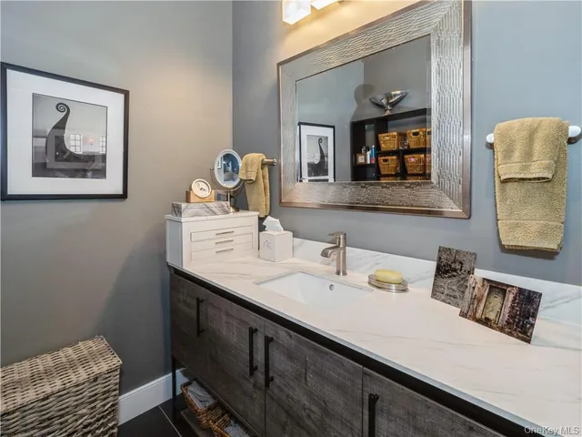 a bathroom with a sink and a mirror