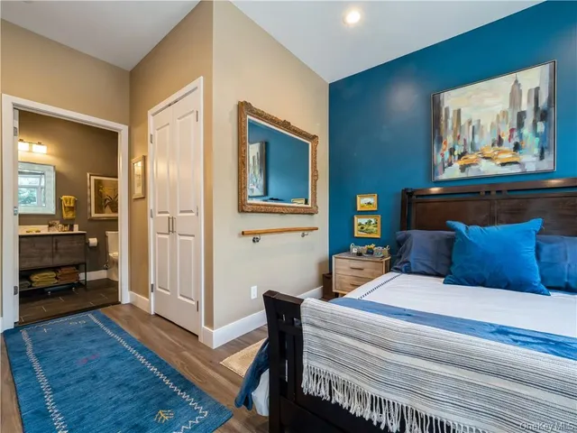 a bedroom with a bed and a view of bedroom