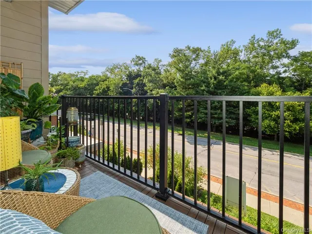 a balcony with chairs