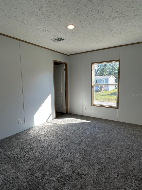 6443 Finance Avenue Weeki Wachee, FL 34607 - Photo 26 of 45 an empty room with windows