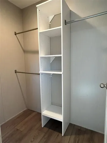 a view of storage and utility room with empty racks