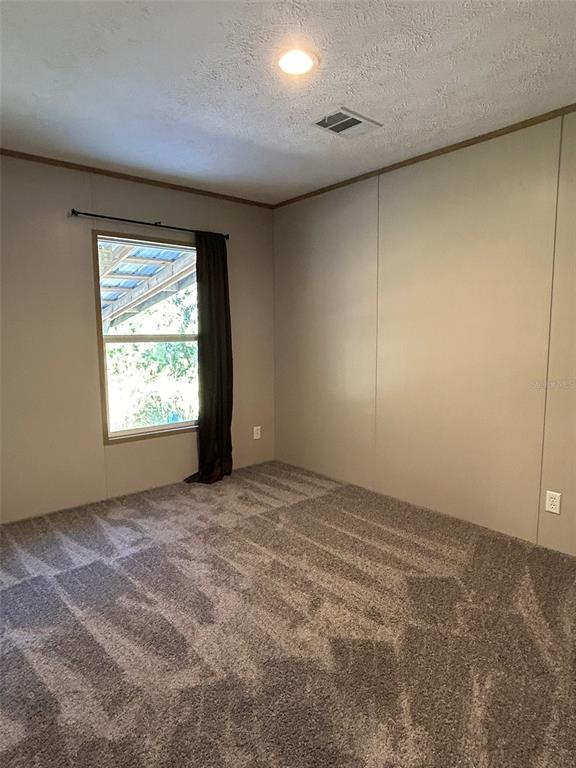 6443 Finance Avenue Weeki Wachee, FL 34607 - Photo 29 of 45 an empty room with windows