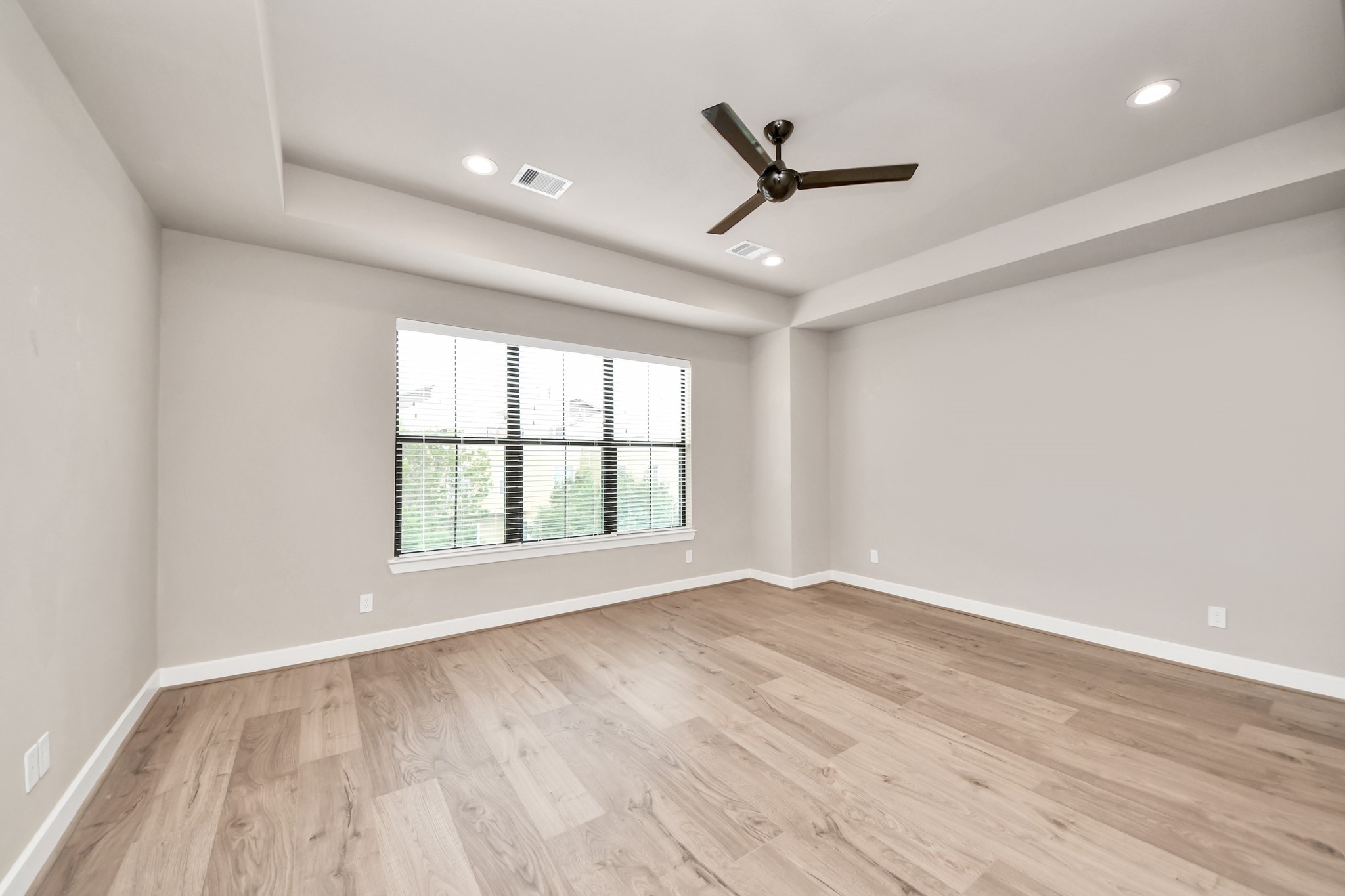 2114 Stuart Street Houston, TX 77004 - Photo 28 of 39 a view of an empty room with a window and wooden floor