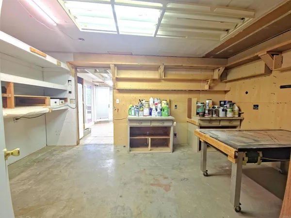 a kitchen with a table and chairs