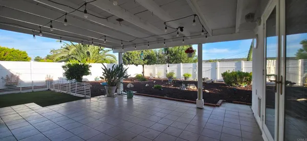 a living room with patio furniture