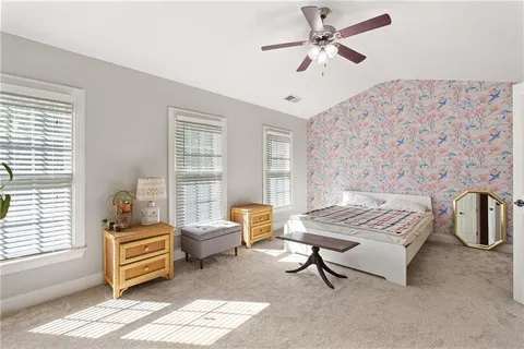 a bedroom with furniture and window