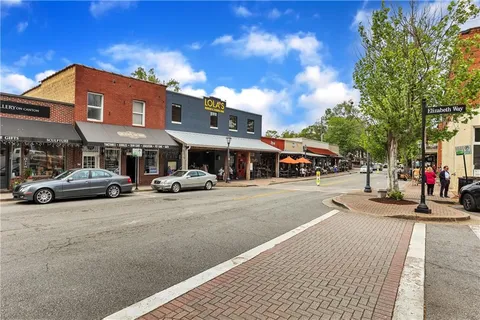 a view of street with parked cars