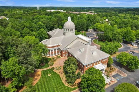a view of a small yard in front of a house with a yard