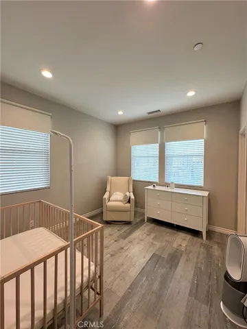a bedroom with furniture and a window