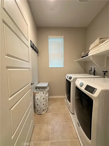 a utility room with washer and dryer