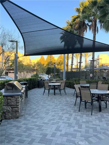 a view of a chairs and table in patio