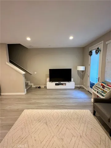a bedroom with furniture and a flat screen tv