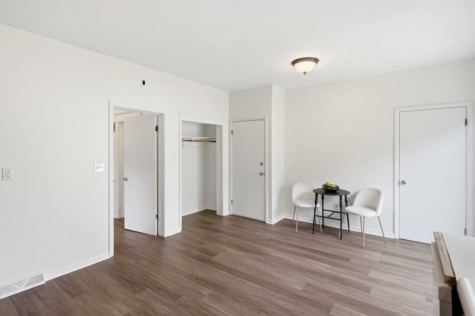 1847 10th Street Moline, IL 61265 - Photo 18 of 39 a view of a room with wooden floor and furniture