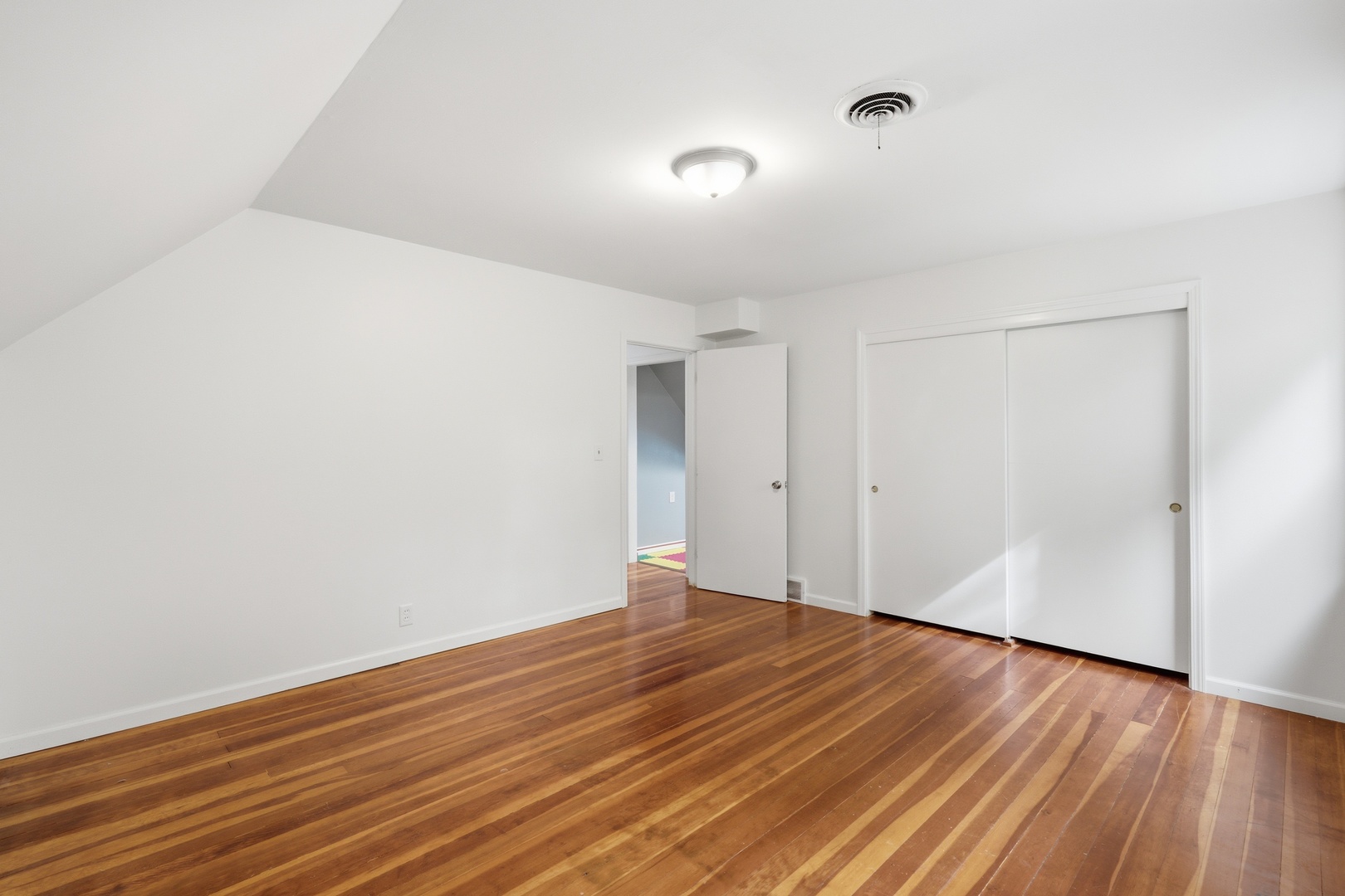 1847 10th Street Moline, IL 61265 - Photo 23 of 39 a view of an empty room with wooden floor