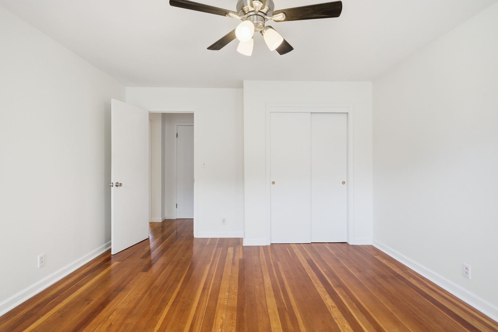 1847 10th Street Moline, IL 61265 - Photo 26 of 39 a view of empty room with wooden floor