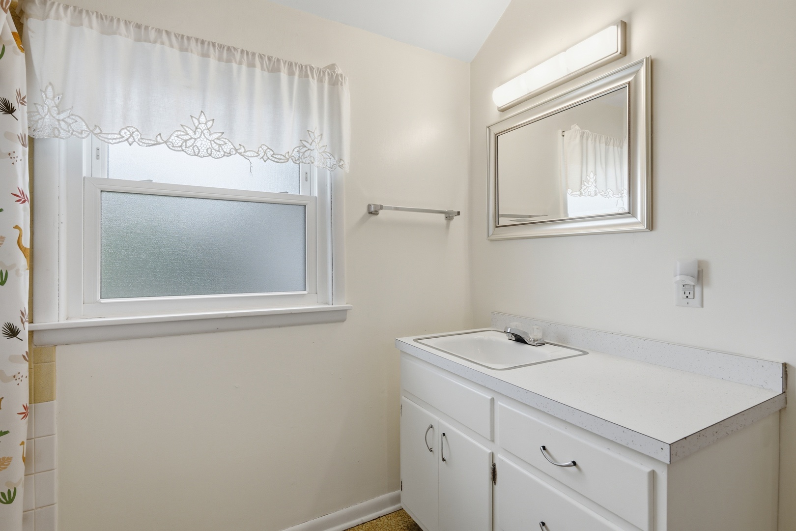 1847 10th Street Moline, IL 61265 - Photo 27 of 39 a bathroom with a sink vanity and a mirror