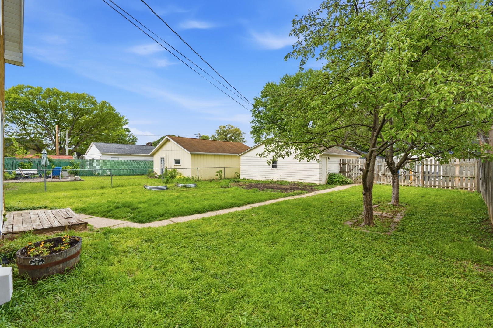 1847 10th Street Moline, IL 61265 - Photo 33 of 39 a view of a house with a big yard and large trees