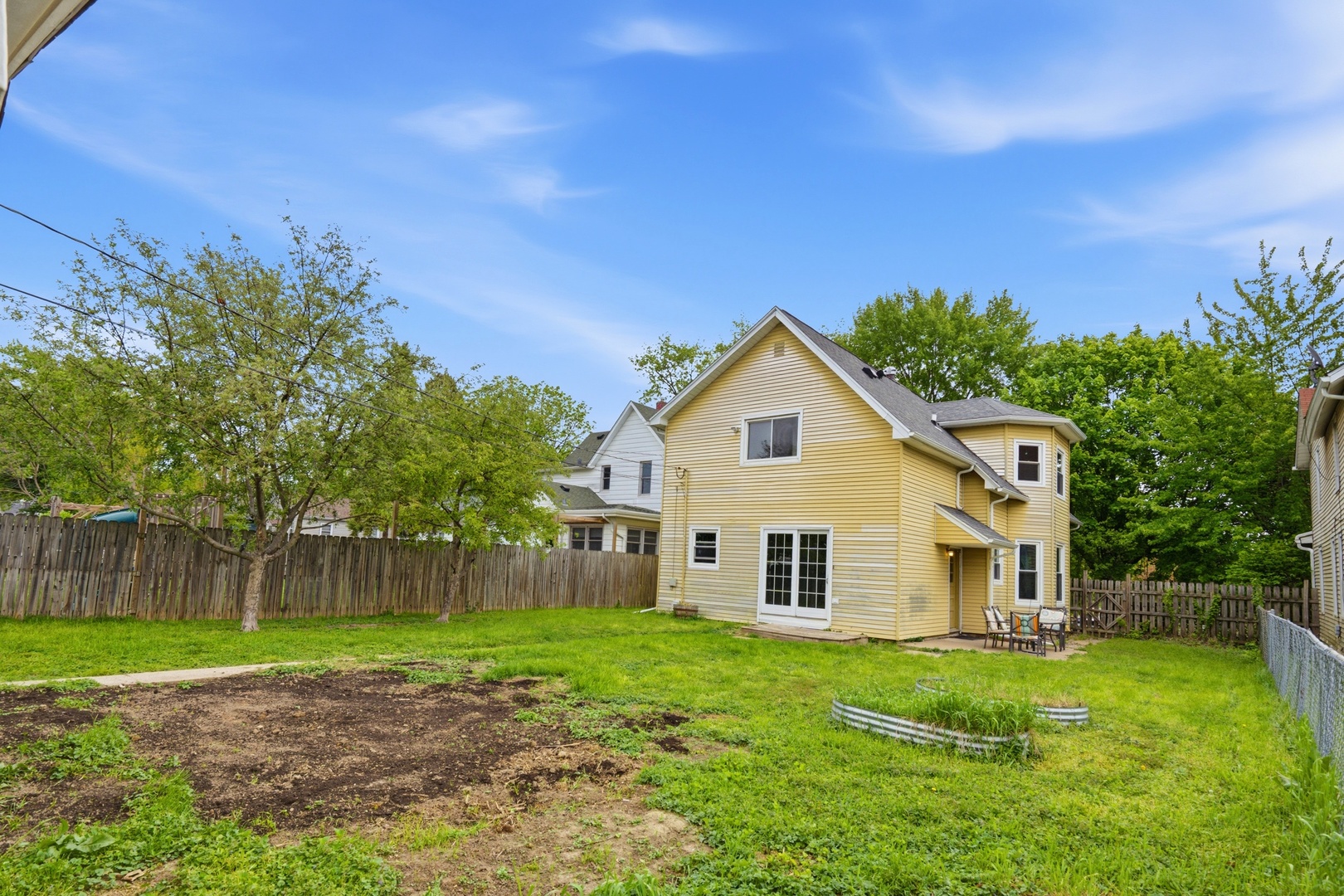 1847 10th Street Moline, IL 61265 - Photo 35 of 39 a view of a house with a yard