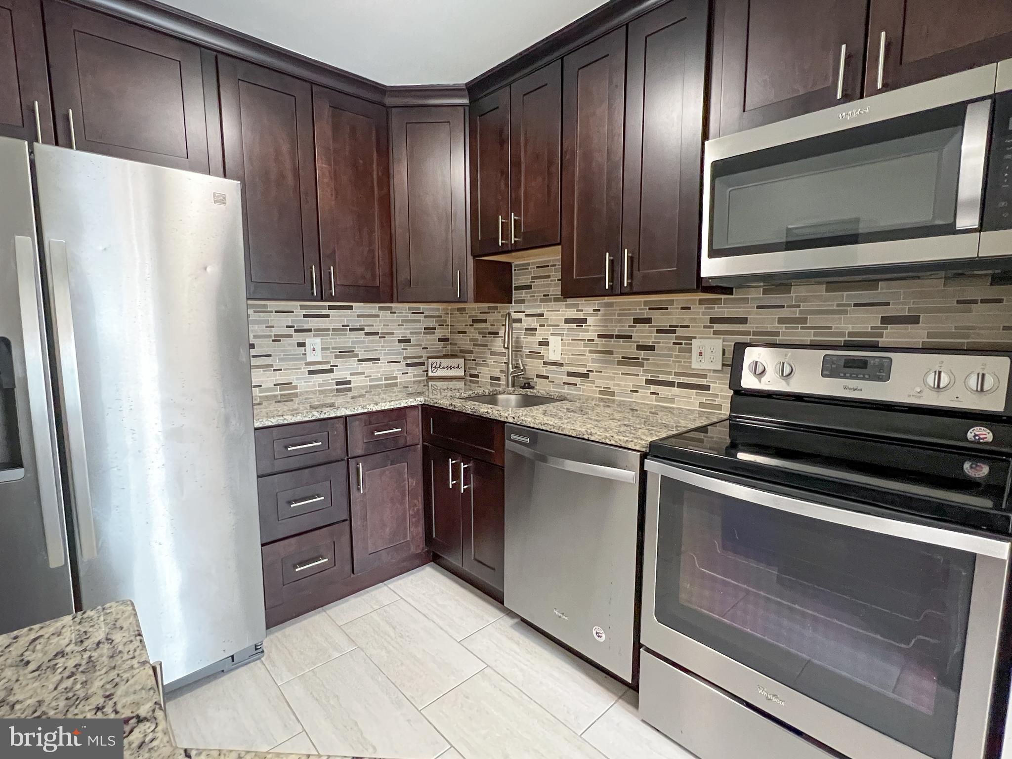 17804 Buehler Road, Unit 146 Olney, MD 20832 - Photo 1 of 31 Kitchen w/Stainless Appliances & Granite Counters