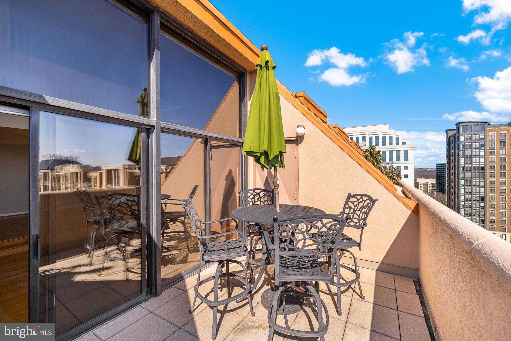 1301 North Courthouse Road, Unit 1805 Arlington, VA 22201 - Photo 21 of 40 a view of balcony with outdoor seating and city view