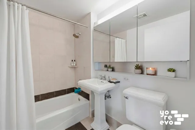 a view of living room with furniture and wooden floor