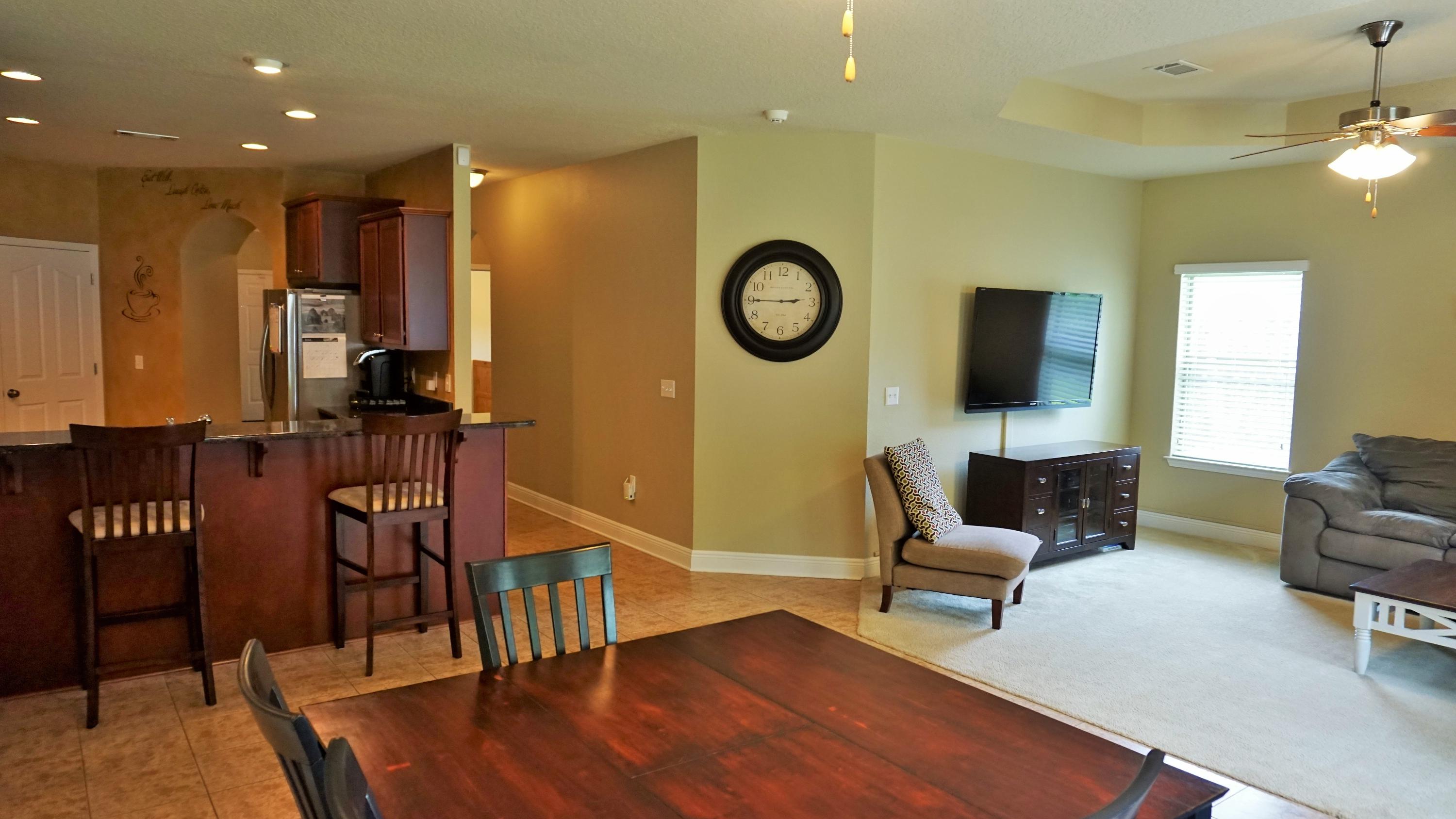 632 Red Fern Road Crestview, FL 32536 - Photo 14 of 36 a living room with furniture and wooden floor