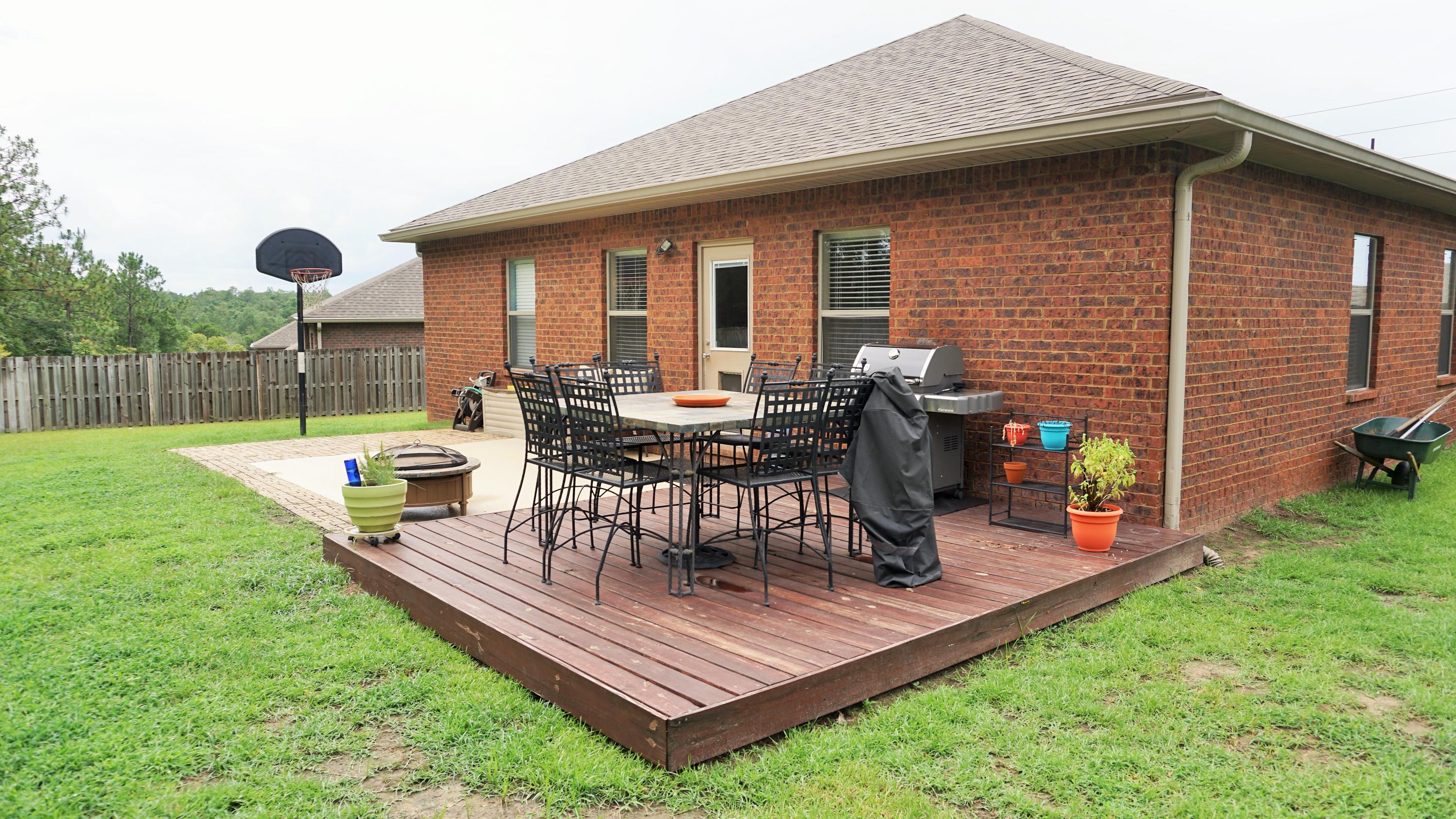 632 Red Fern Road Crestview, FL 32536 - Photo 23 of 36 a view of a backyard with a patio and a garden