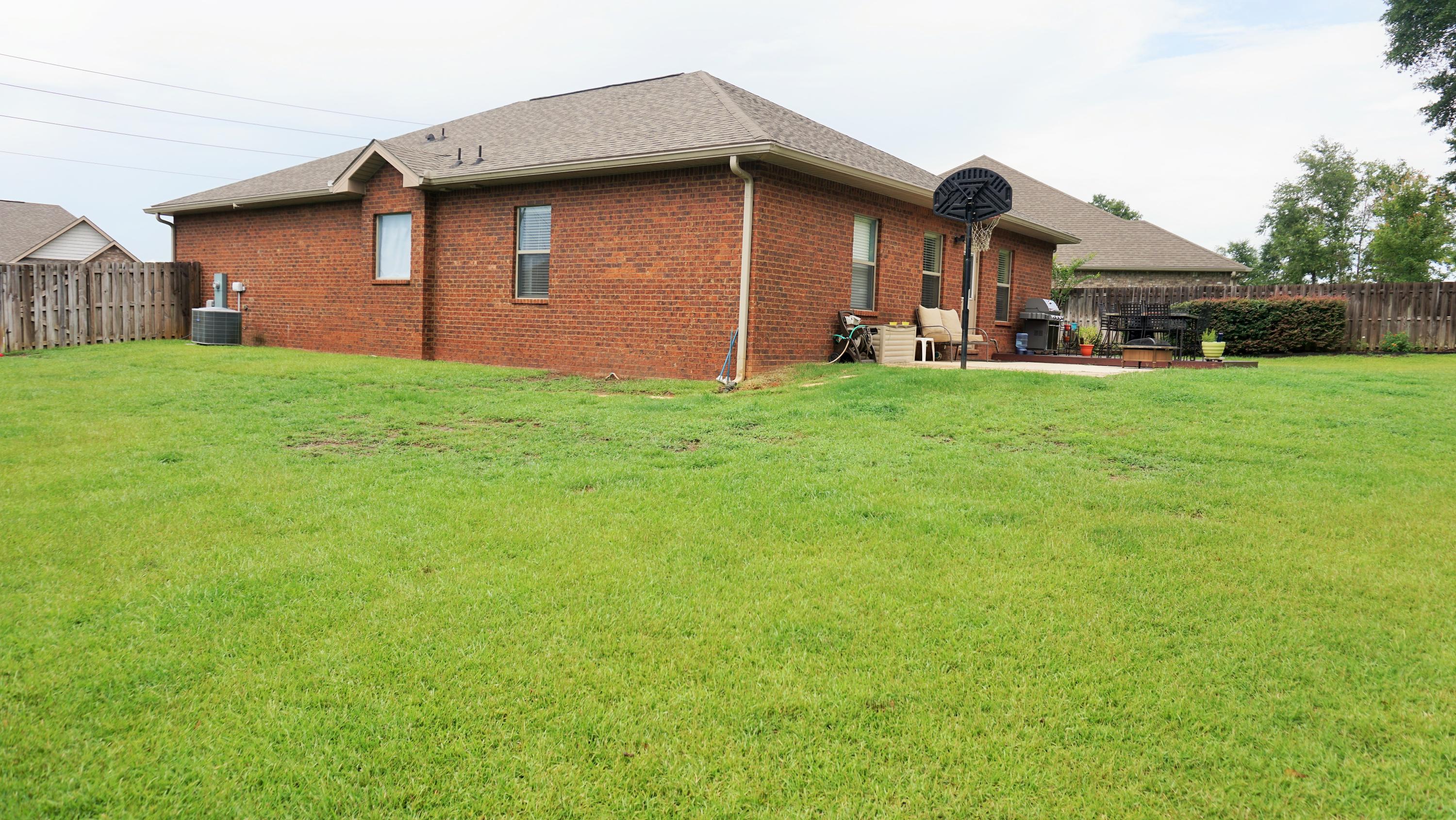 632 Red Fern Road Crestview, FL 32536 - Photo 29 of 36 a backyard of a house with lots of green space