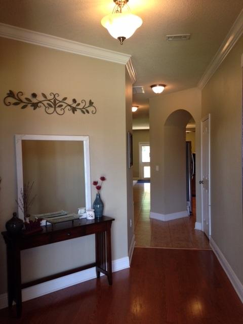 632 Red Fern Road Crestview, FL 32536 - Photo 5 of 36 a living room with furniture and a flat screen tv