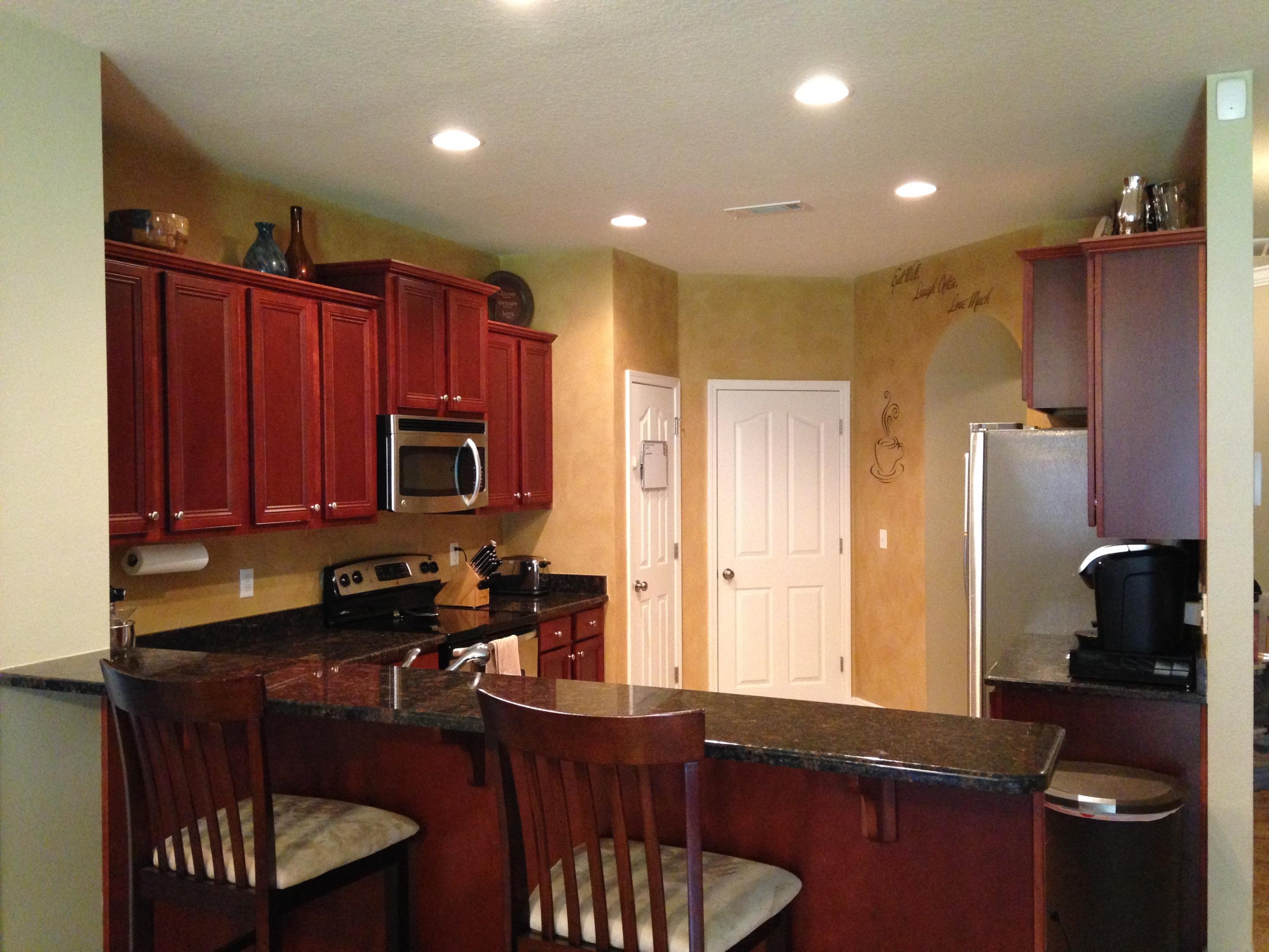 632 Red Fern Road Crestview, FL 32536 - Photo 7 of 36 a kitchen with a sink stove and refrigerator